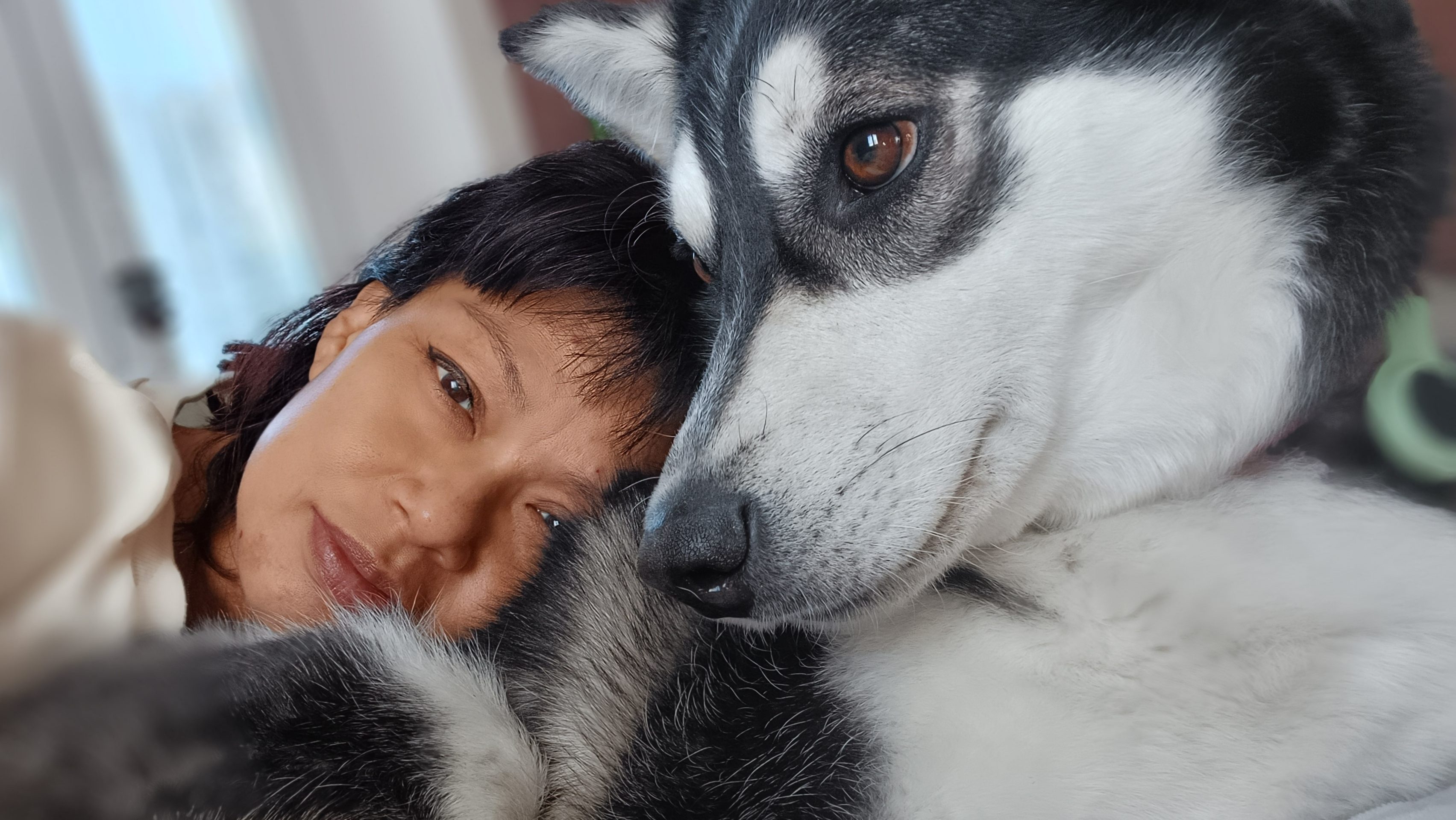 Genevieve with her dog Marilyn at Genevieve Grove, a countryside retreat in Vinci, Tuscany focused on simple living and connection with animals.