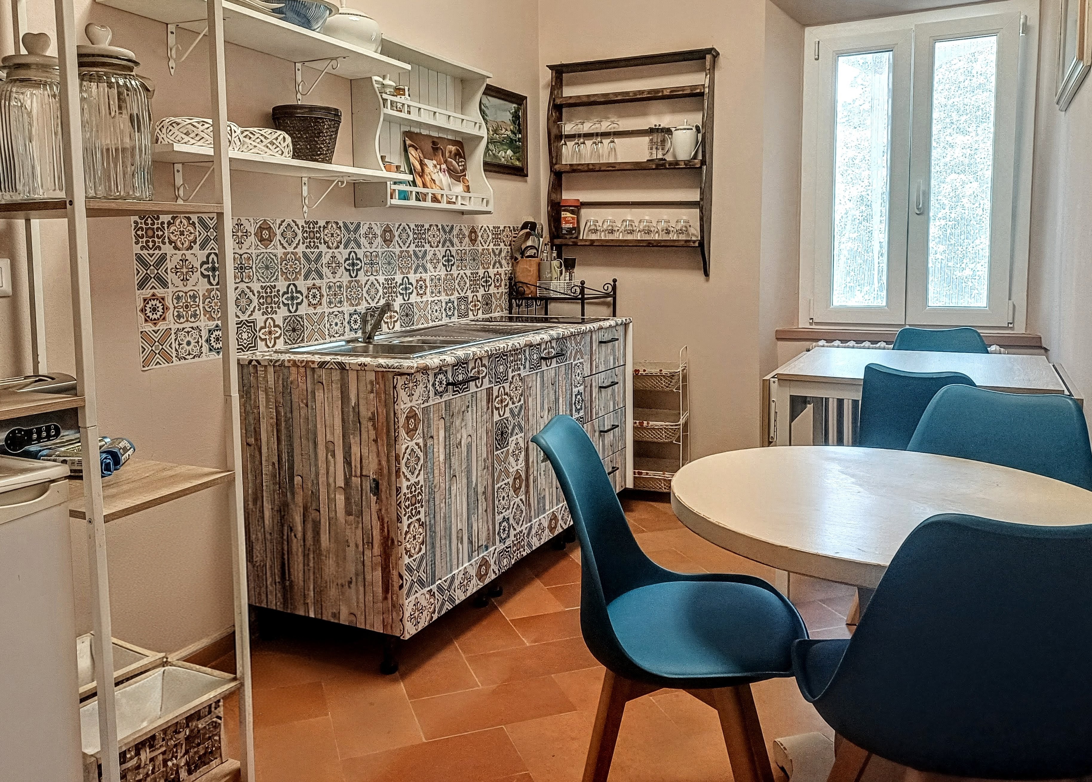Shared kitchen and dining area for guests at Genevieve Grove in Tuscany.