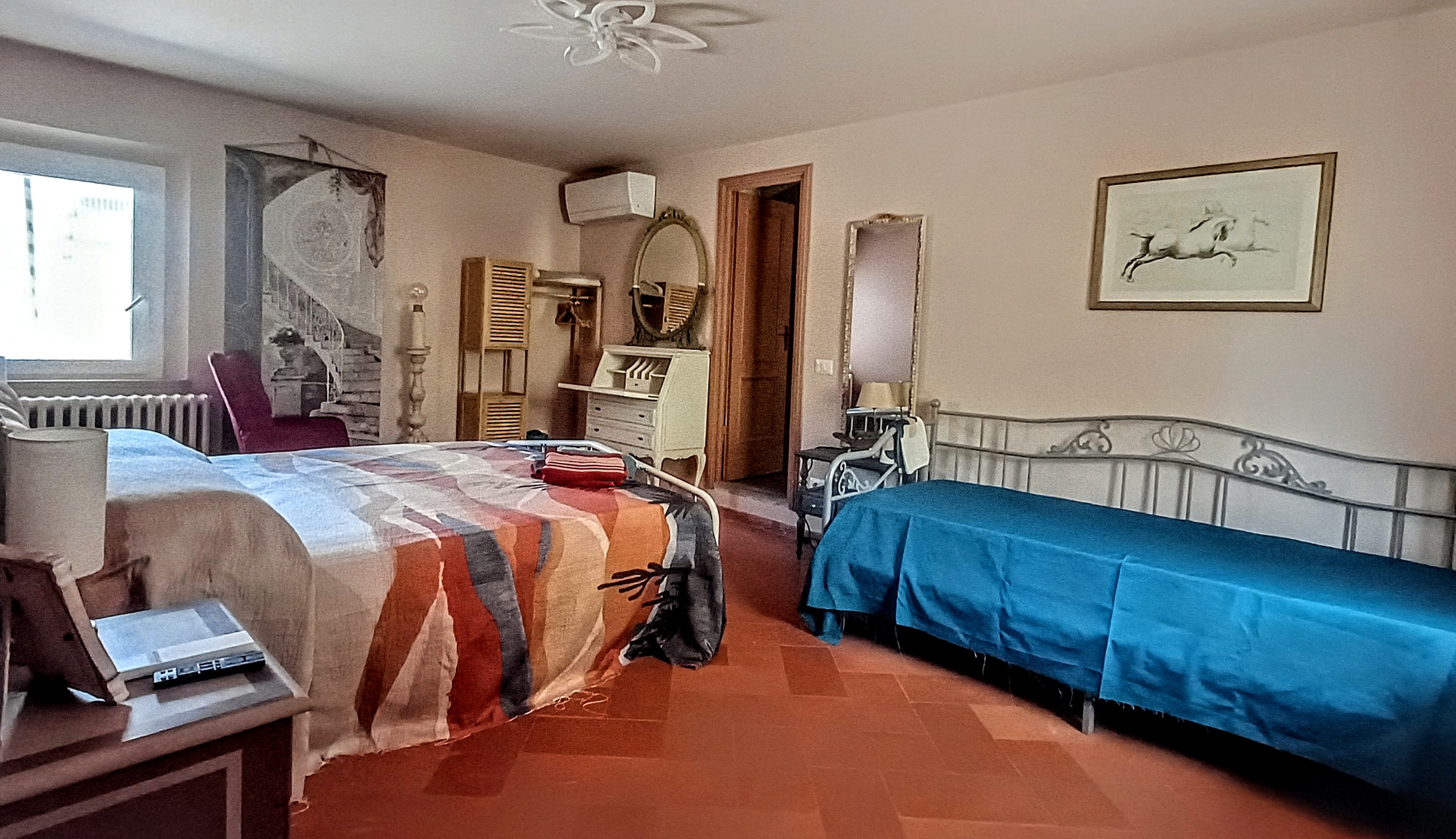 Camellia Room at Genevieve Grove, a spacious and comfortable guest room in the Tuscan countryside.