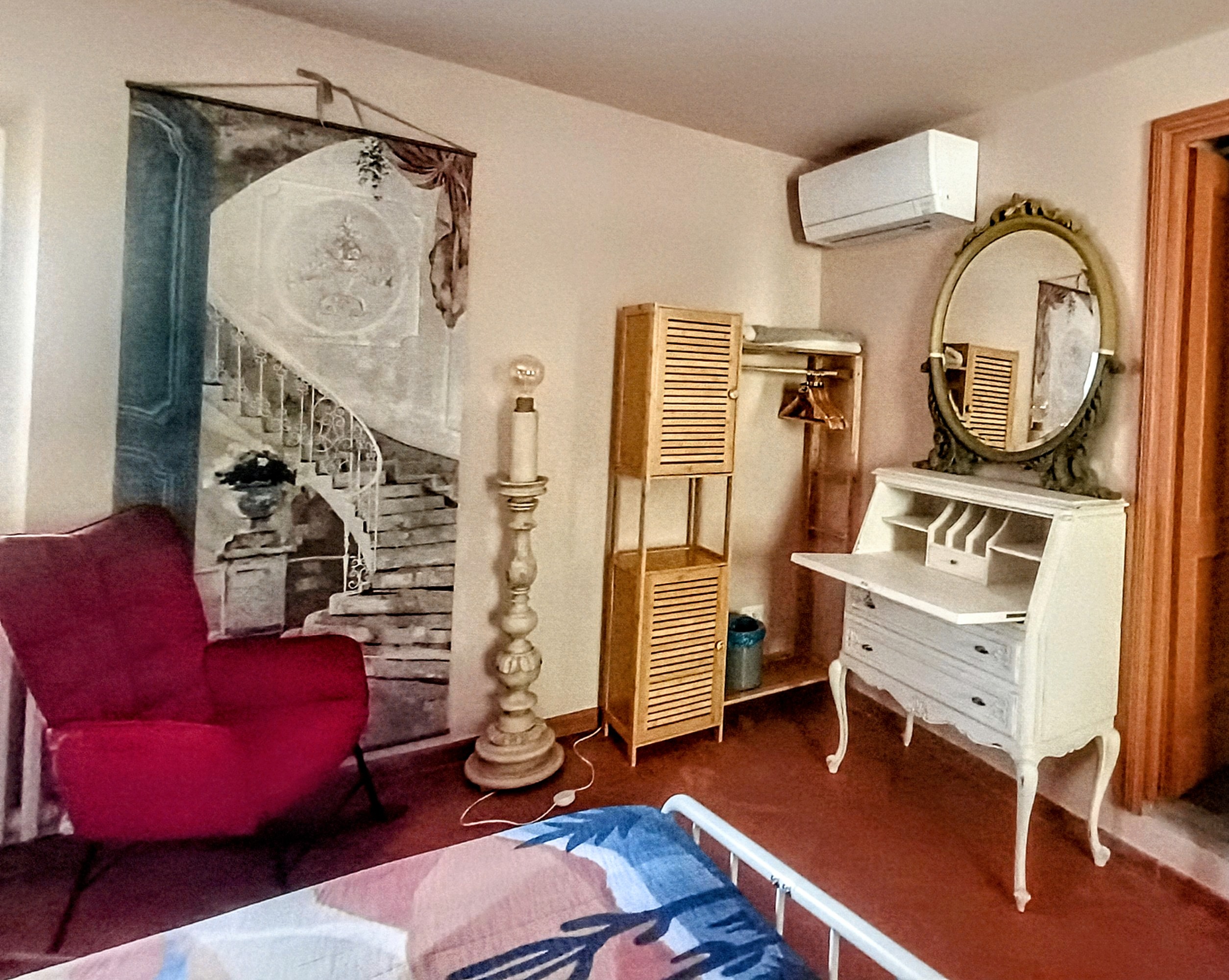 Armchair and decorative furnishings inside La Camelia Room at Genevieve Grove