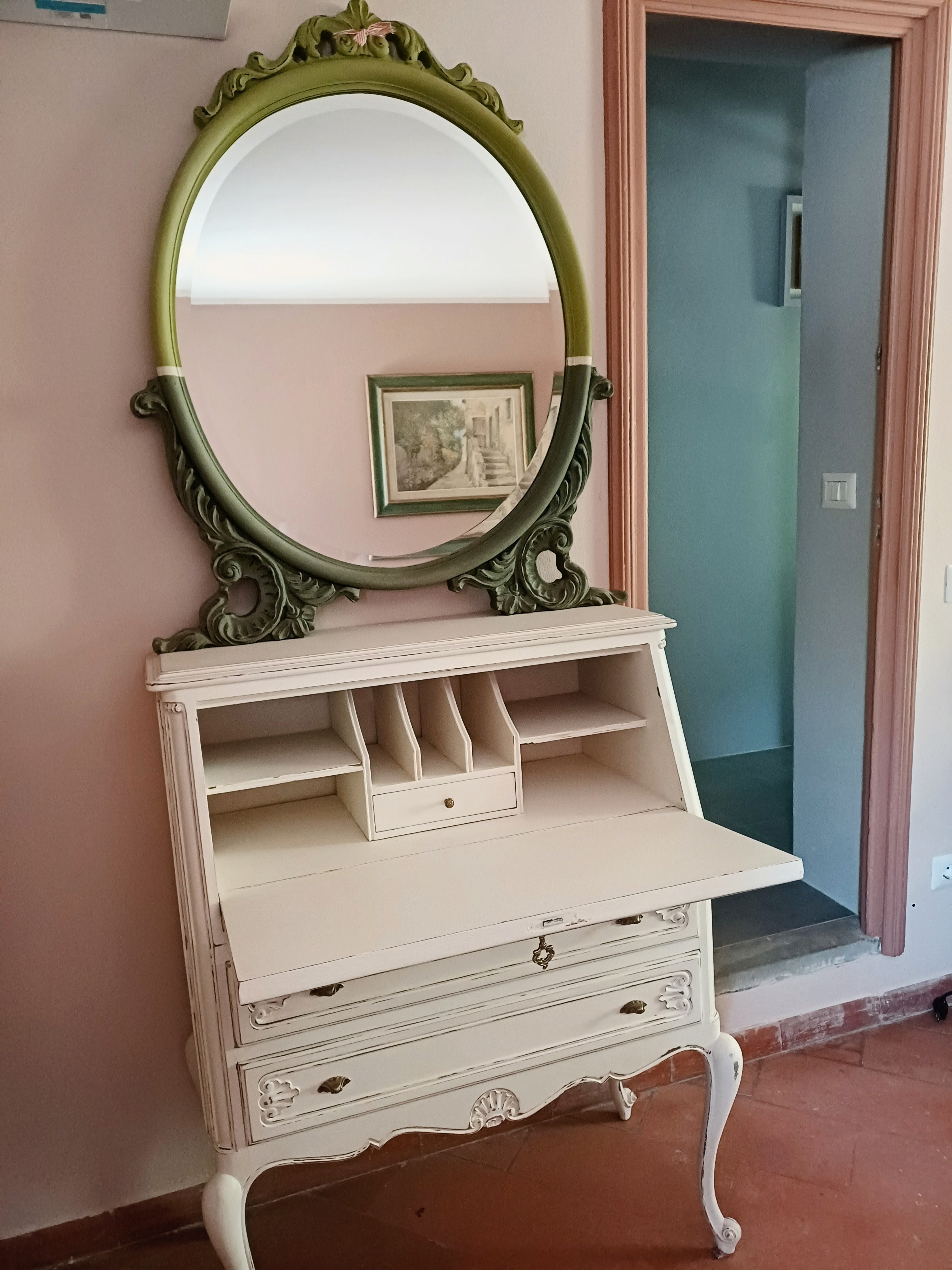 Decorative vintage desk and ornate mirror in La Camelia Room at Genevieve Grove