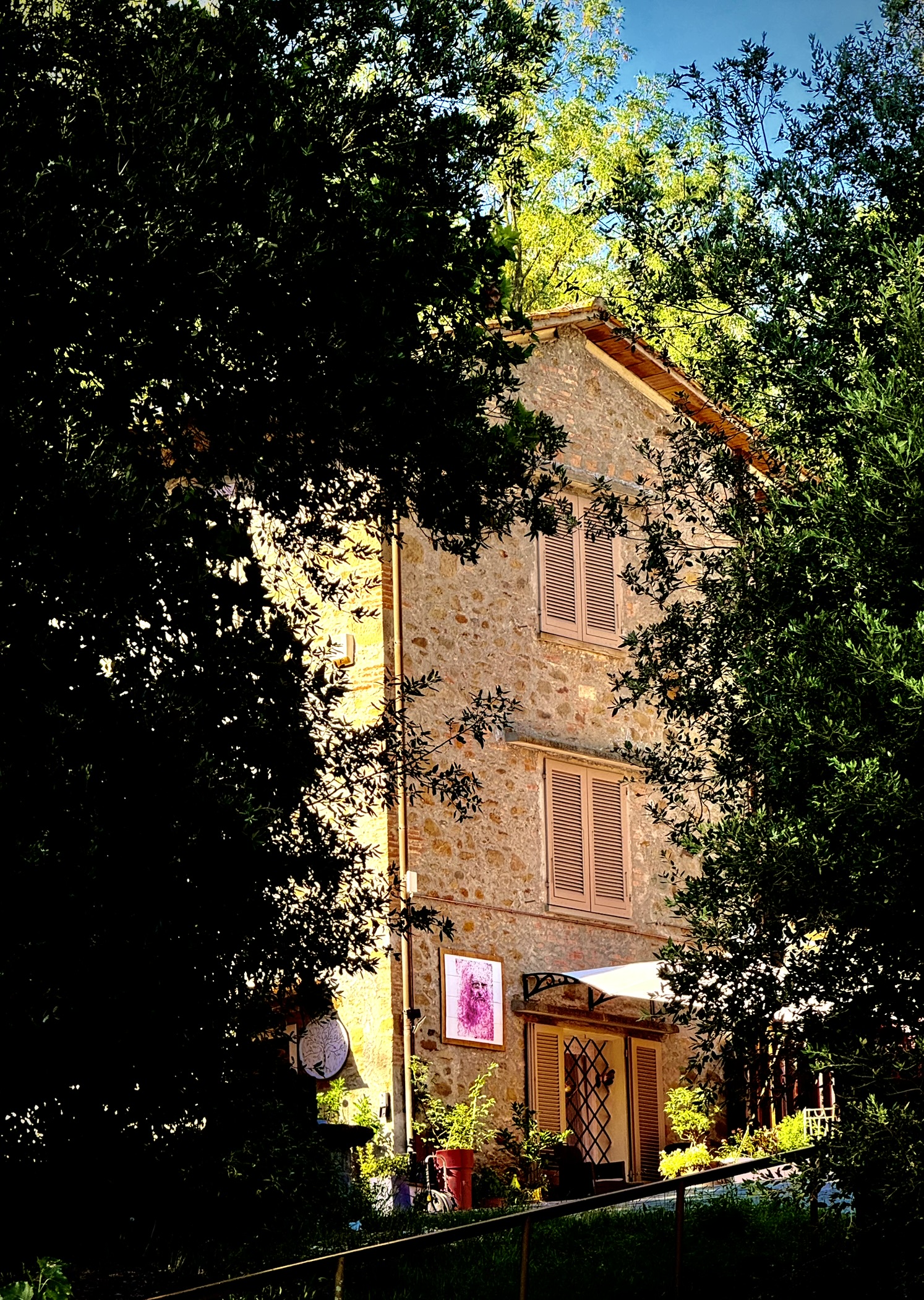Genevieve Grove, a traditional Tuscan stone country house surrounded by olive trees in Vinci, Tuscany.